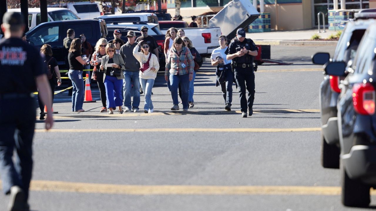 People walk at a family reunification location at Journey Church following a shooting at Silver Rail Elementary School in Bend, Oregon, US, October 15, 2026. REUTERS/Rob Kerr