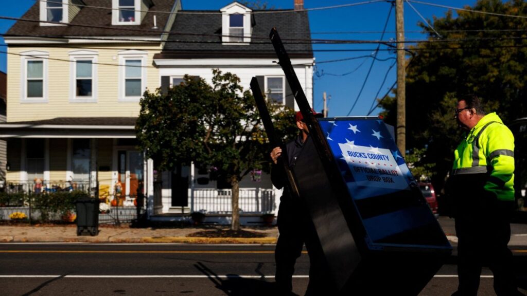 A Bucks County Board of Elections employee distributes a Bucks County official ballot drop box to Margaret R. Grundy Memorial Library ahead of mail-in ballot drop offs in Bristol, Pennsylvania, US, October 13, 2026. REUTERS/Hannah Beier