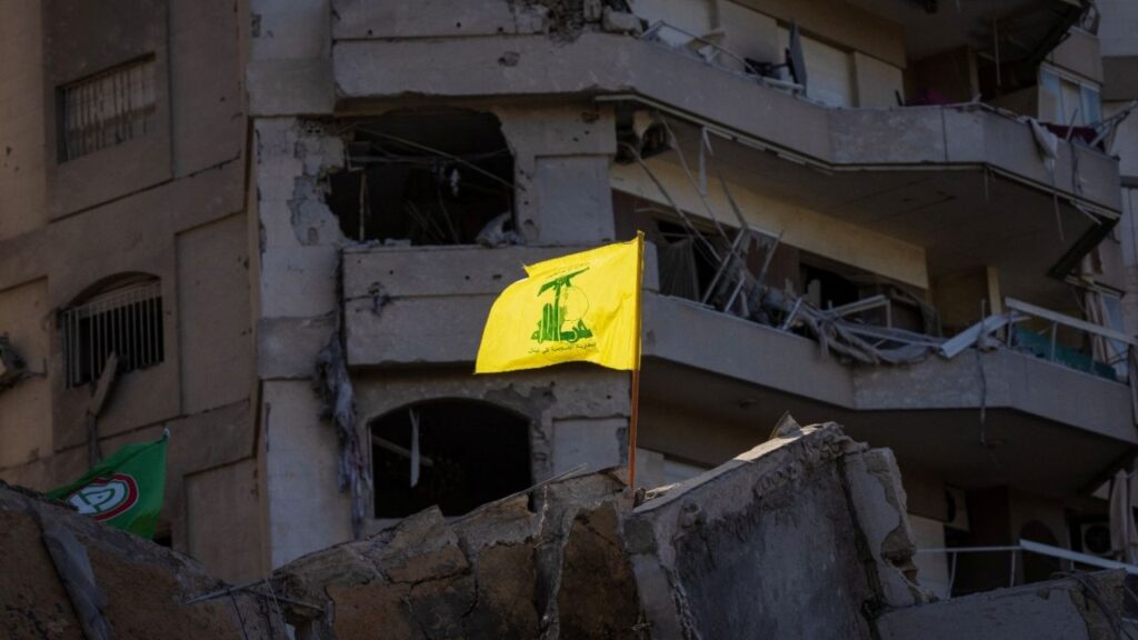 A Hezbollah flag is seen on the rubble of a damaged apartment building in the aftermath of an Israeli strike, amid the ongoing hostilities between Hezbollah and Israeli forces, in Tayouneh, Beirut, Lebanon November 16, 2024. (Reuters File)