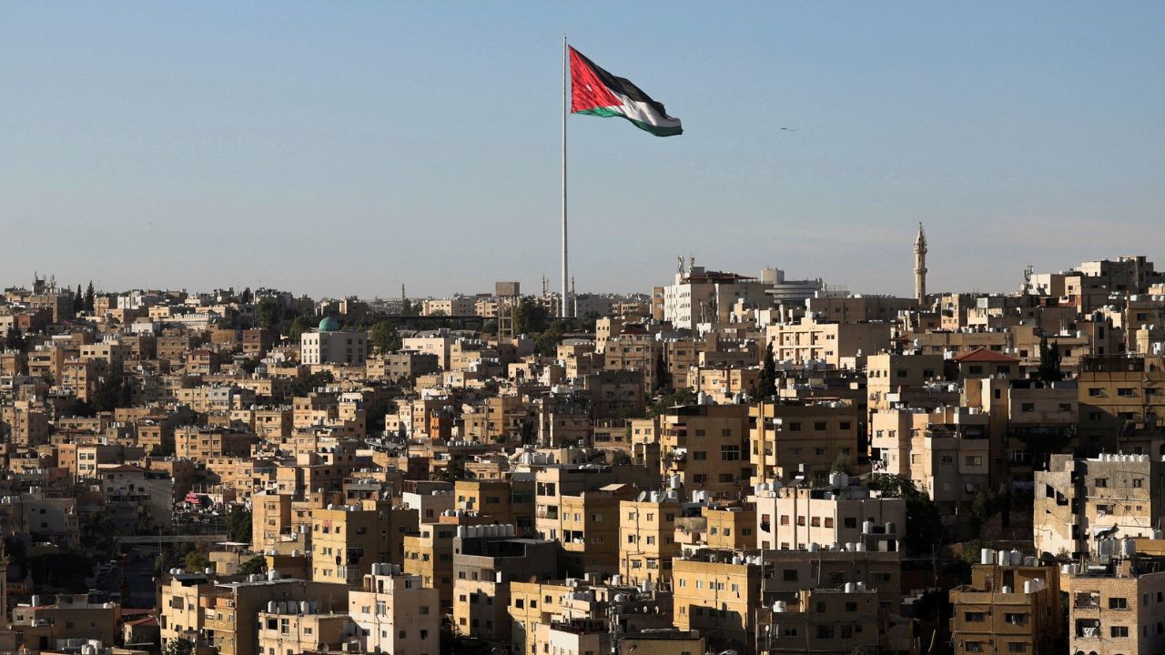 A Jordanian flag flies over the capital city, Amman, Jordan August 17, 2025. REUTERS/Mohamed Abd El Ghany