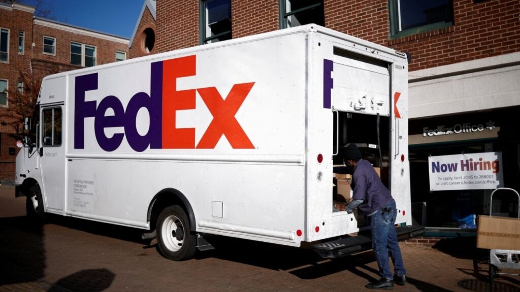 A driver of FedEx loads packages into a delivery truck during Black Friday preparations in the Georgetown neighborhood of Washington, U.S., November 26, 2024. (Reuters File)