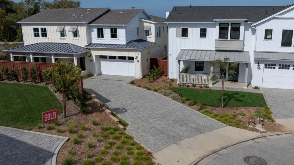A drone view shows a sold sign next to newly built single-family residential homes at a small costal development in Encinitas, California, U.S., August 20, 2026. (Reuters File)