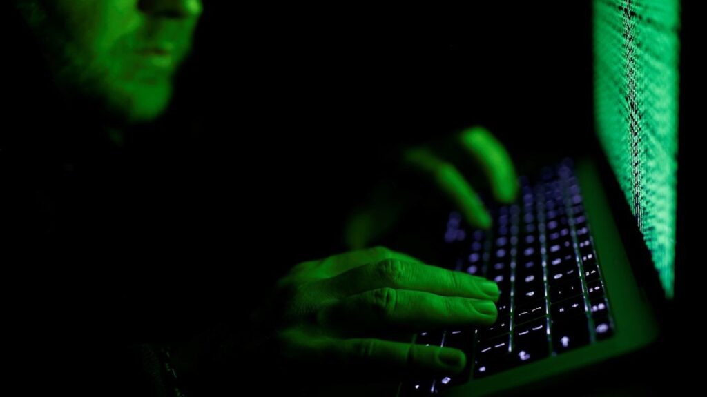 A man types on a computer keyboard in front of the displayed cyber code in this illustration picture taken on March 1, 2017. (Reuters File)