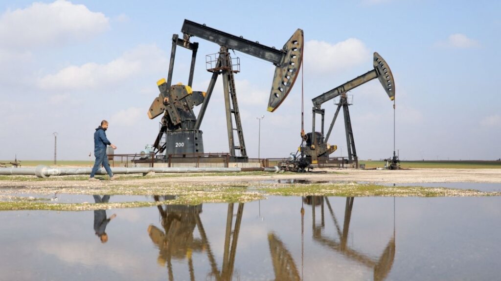 A man walks next to pumpjacks in Rmelan, Syria, February 9, 2026. REUTERS/Orhan Qereman
