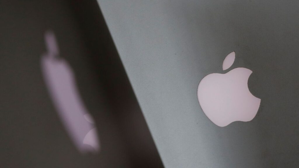 Apple company logos are seen as two MacBooks stand next to each other in an office in Vienna, Austria January 3, 2019. (Reuters File)