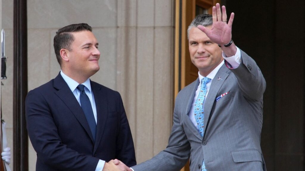 Britain's Defence Minister Wes Streeting shakes hands with US Defense Secretary Pete Hegseth during a visit to the Pentagon in Arlington, Virginia, US, October 15, 2026. REUTERS/Nathan Howard