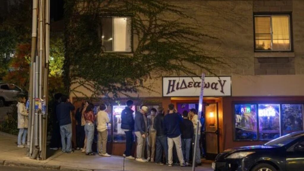 Cornell University students wait to get inside a bar in Collegetown, near campus, in Ithaca, N.Y., on Saturday, Oct. 17, 2026. The moratorium is among the safety measures that the university put in place following the uproar over a former student’s sexual assault lawsuit. (Lauren Petracca/The New York Times).