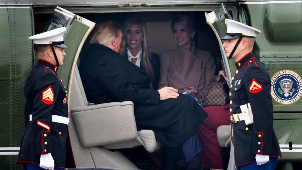 Image of President Trump inside Marine One with two blonde-haired young women