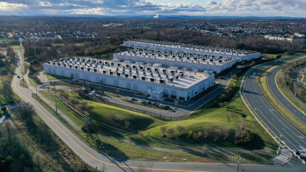 Data centers owned and operated by Amazon Web Services in Ashburn, Va., March 10, 2024. As technology companies try to address increasingly hostile local sentiment toward data center projects, Amazon has pledged $1 billion over five years to communities for work force development, energy efficiency projects and other local priorities. (Nathan Howard/The New York Times)