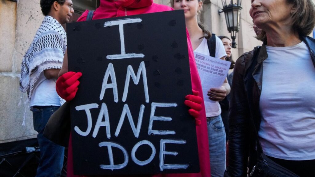 Demonstrators rally outside the Columbia University during a Stop Sexual Violence protest as part of US rallies being held in the wake of the Cornell University rape allegations, in New York City, US, October 8, 2026. REUTERS/Eduardo Munoz
