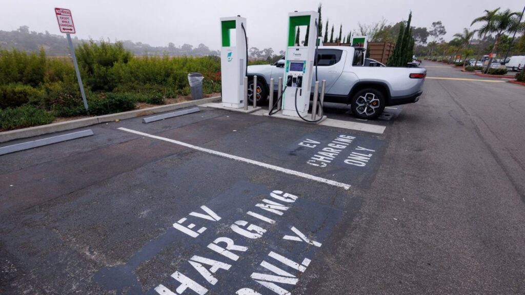Electric vehicle chargers from Electrify America are shown in a shopping center parking lot in Oceanside, California, U.S., October 19, 2023. (Reuters File)