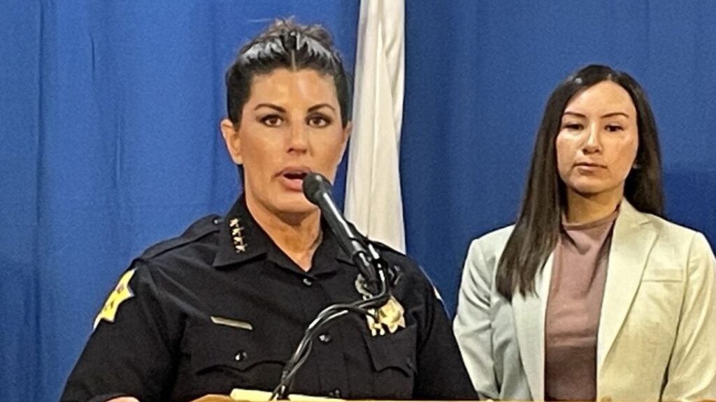 Fresno police arrested a 16-year-old Fowler boy in connection with Sunday's Tower District shooting that injured two people, including an innocent bystander. Photo: Fresno Police Chief (left) speaks at a podium with Fresno City Councilmember Annalisa Perea. (GV Wire/Bryant-Jon Anteola)
