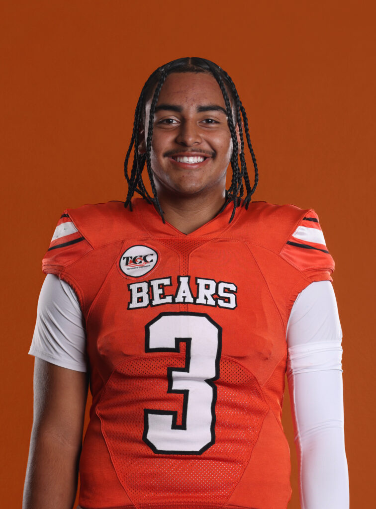 Portrait of Selma HS quarterback Adam Soria in his No. 3 orange football jersey