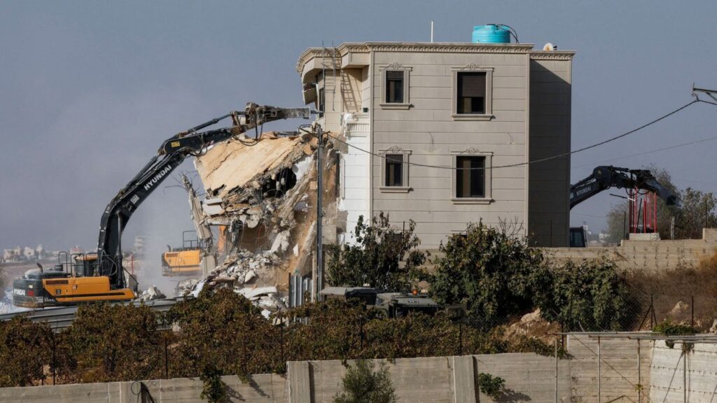 Israeli machinery demolishes a Palestinian house following a shooting attack, in Hebron in the Israeli-occupied West Bank, October 23, 2026. REUTERS/Mussa Qawasma