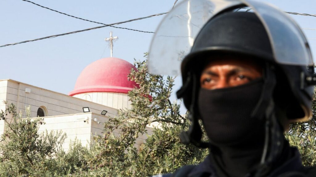A member of security personnel stands outside Saint George’s Greek Orthodox Church, where gunmen opened fire during a funeral the previous day, in the village of Hamoud, Karak, Jordan, October 24, 2026. Reuters/Alaa Al Sukhni