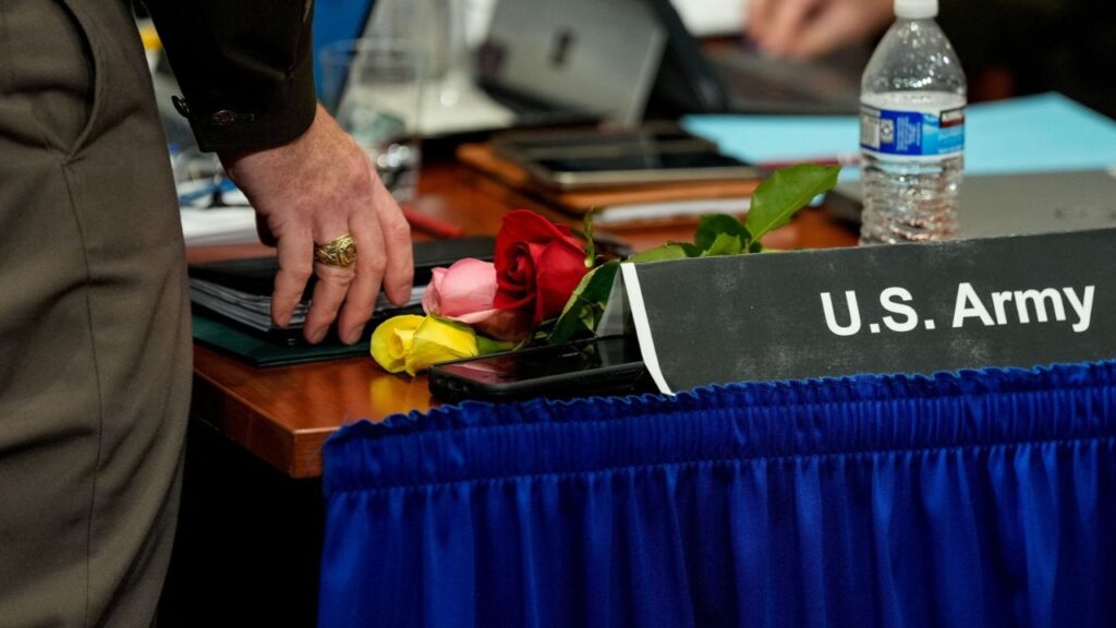Loose roses that were presented to members of the U.S. Army by family members of crash victims are seen on a table during a brief break during day three of a National Transportation Safety Board (NTSB) investigative hearing on the January 29 mid-air collision of an Army Sikorsky UH-60L Black Hawk helicopter and American Airlines flight 5342 over the Potomac River near Ronald Reagan Washington National Airport, at NTSB headquarters in Washington, D.C., U.S., August 1, 2025. REUTERS/Kent Nishimura