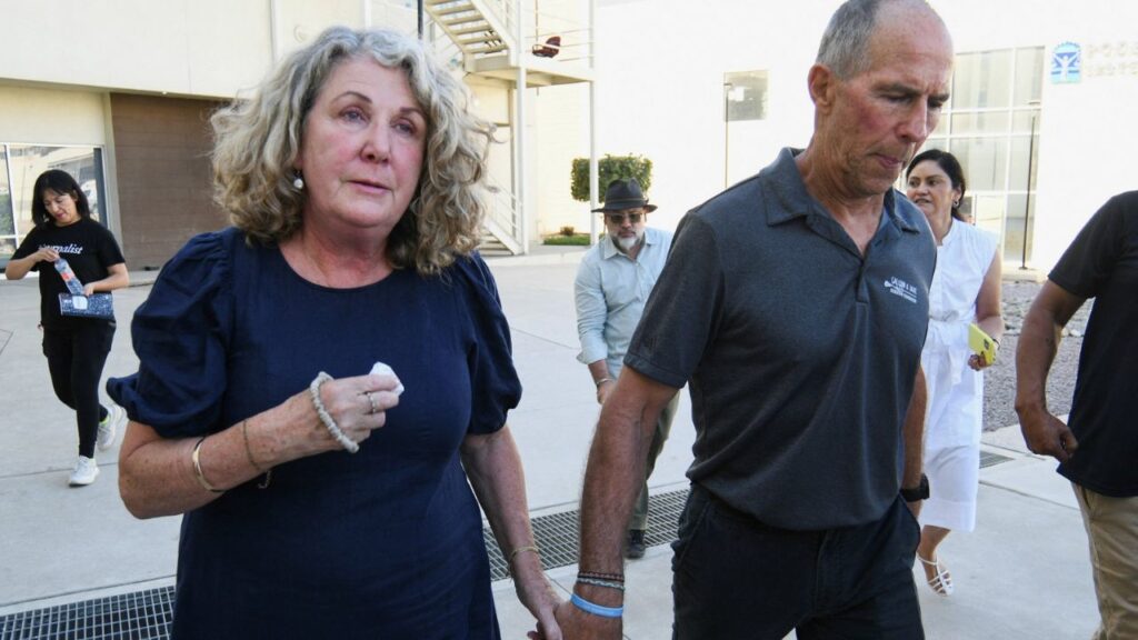 Martin and Debra Robinson, parents of Australian brothers Callum and Jake Robinson, who were killed during a surfing trip in April 2024, leave the Baja California State Palace of Justice after a Mexican judge found three men guilty of the murders of their sons and their American friend Jack Carter Rhoad, in Ensenada, Mexico, October 9, 2026. REUTERS/Enrique Botello