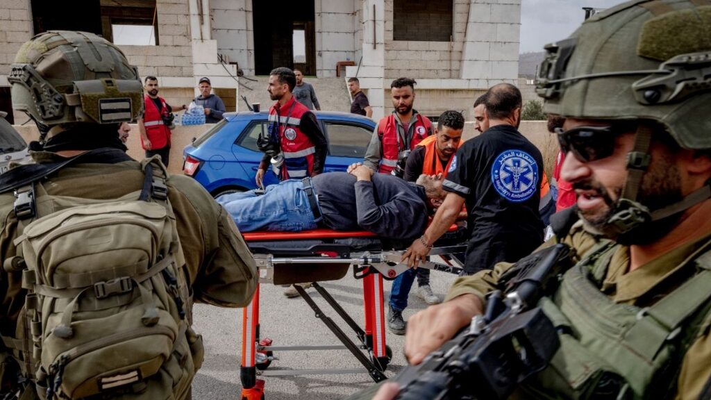 Medics transport a member of a local council after he was shot by Israeli soldiers in Khirbet Abu Falah in the Israeli-occupied West Bank, Oct. 16, 2026. United Nations human rights experts said on Monday, Oct. 26, 2026, that Israel is targeting Palestinian civilians, continuing to commit genocidal acts in Gaza despite a cease-fire agreement there and carrying out crimes against humanity in the West Bank. (Ivor Prickett/The New York Times)
