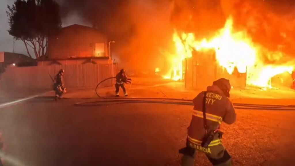 More than 20 vehicles were damaged or destroyed in a Fresno warehouse fire Wednesday morning that also left a firefighter with a minor burn injury, authorities said. (Fresno FD)