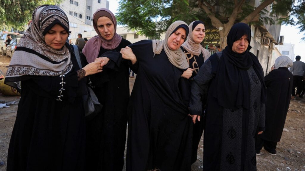 Mourners attend the funeral of Palestinian man Akram Yassin and his wife Dina Abu Baker, who were killed in an Israeli strike, in Gaza City October 20, 2026. REUTERS/Dawoud Abu Alkas