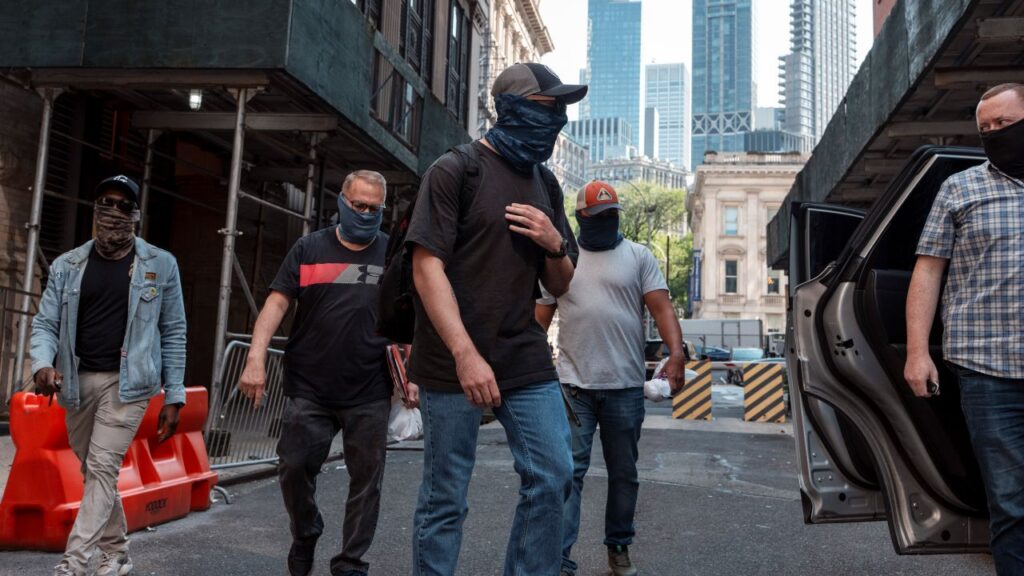 Image of masked ICE agents roaming the streets of Manhattan