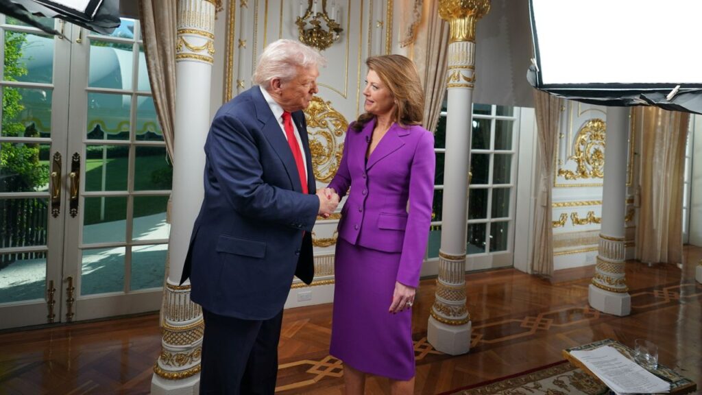 Image of President Trump shaking hands with Norah O'Donnell