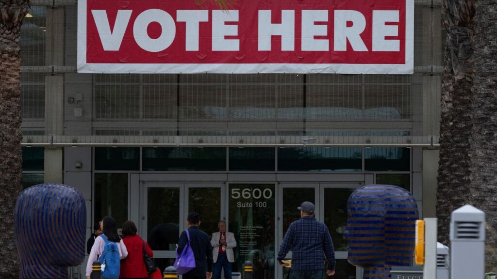 People arrive to drop off their election ballots or vote during the California primary election in San Diego, California, U.S., June 2, 2026. REUTERS/Mike Blake