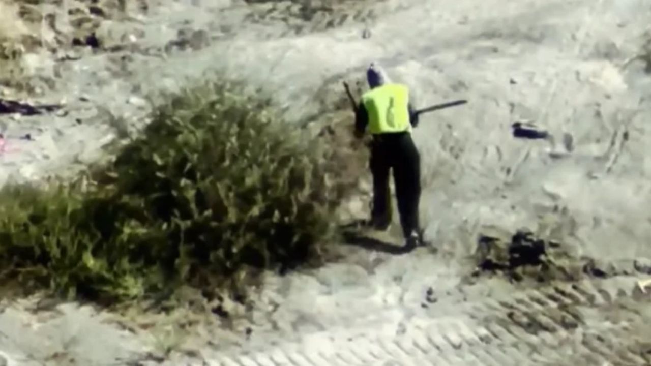 Porterville police arrested a masked man Wednesday after a drone spotted him carrying what appeared to be a rifle near the Tule River. (Porterville PD)