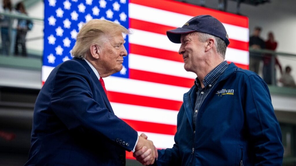 President Donald Trump with Sen. Dan Sullivan (R-Alaska) at a campaign rally in Wasilla, Alaska, Oct. 13, 2026. President Trump’s Justice Department filed a lawsuit in federal court last week seeking to toss the election results if votes for the challenger Dan J. Sullivan cost Senator Sullivan the win. (Doug Mills/The New York Times)