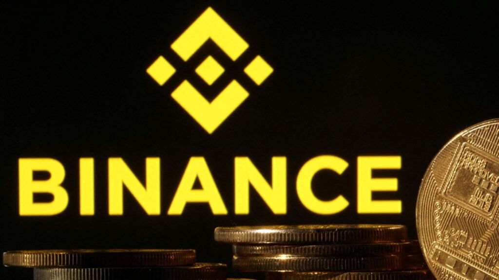 Representations of cryptocurrencies are seen in front of displayed Binance logo in this illustration taken November 10, 2022. (Reuters File)
