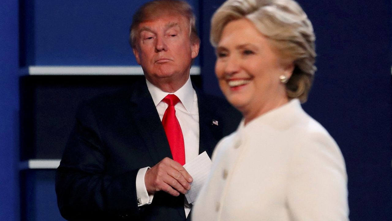 Republican U.S. presidential nominee Donald Trump and Democratic U.S. presidential nominee Hillary Clinton finish their third and final 2016 presidential campaign debate at UNLV in Las Vegas, Nevada, U.S., October 19, 2016. (Reuters File)