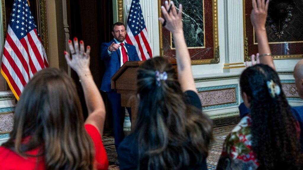 Secretary of Homeland Security Markwayne Mullin takes questions from reporters at the Eisenhower Executive Office Building in Washington, July 17, 2026. The Trump administration is considering using ships to deport migrants to Central and South America on journeys that could take days and cost millions of dollars, according to two U.S. officials. (Alex Kent/The New York Times)