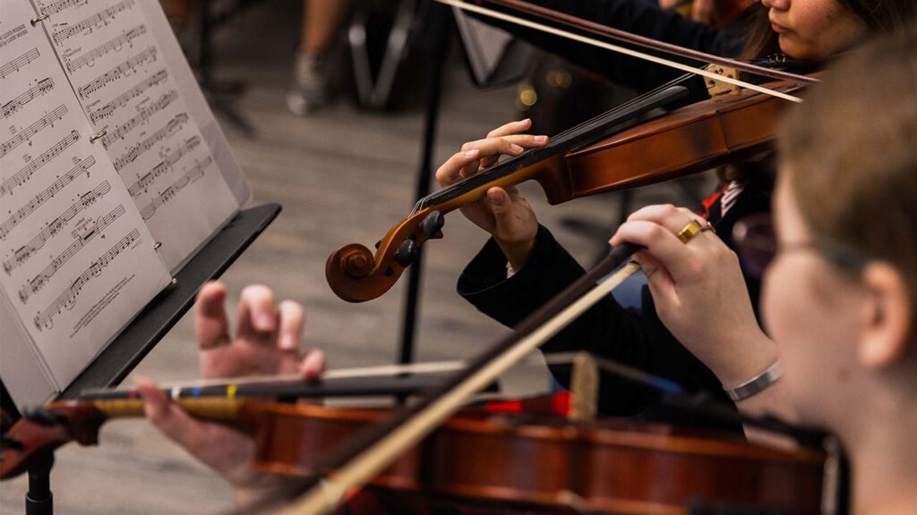 An orchestra class practices at Herbert Hoover High School in Elkview, W.Va. on Sept. 24, 2026. Many school music programs, reliant on inexpensive beginner instruments from China, were already under financial strain. Now, the Trump administration has proposed an additional 25 percent tariffs on trumpets, tubas and other brass instruments, citing “national security threats.” (Maddie McGarvey/The New York Times)