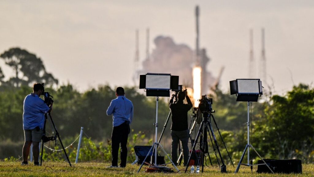 Photographers watch a SpaceX Falcon 9 rocket lift off from the Cape Canaveral Space Force Station with a payload of Starlink v2-mini satellites in Cape Canaveral, Florida, U.S., April 2, 2026. Reuters/Steve Nesius