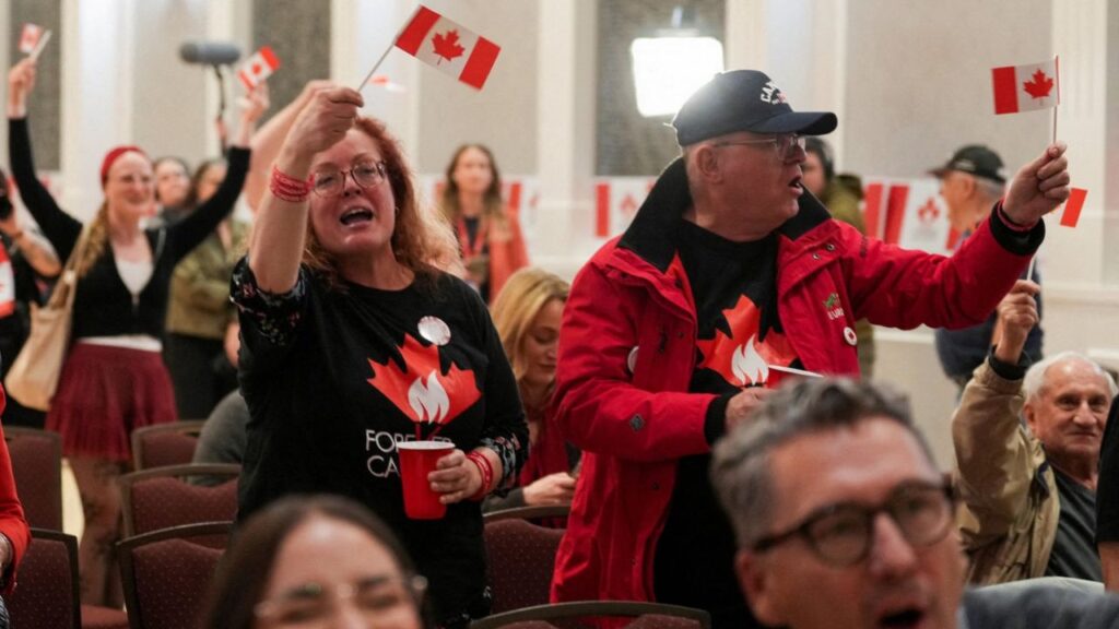 Supporters of the Forever Canadian group, who want Alberta to remain in Canada, wave Canadian flags as they watch the results of a non-binding referendum on Alberta sovereignty in Edmonton, Alberta, Canada October 19, 2026. REUTERS/Todd Korol