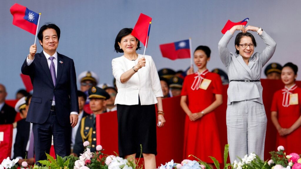 Taiwan President Lai Ching-te, first lady Wu Mei-ju and Vice President Hsiao Bi-khim wave Taiwanese flags during National Day celebrations in Taipei, Taiwan, October 10, 2026. Reuters/Ann Wang