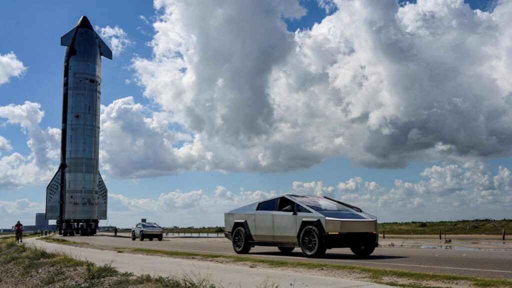 Tesla Cyber Trucks lead the way as the SpaceX Starship spacecraft rolls out toward the launch pad before its 11th test flight from the company's complex in Starbase, Texas, U.S., October 11, 2025. (Reuters File)