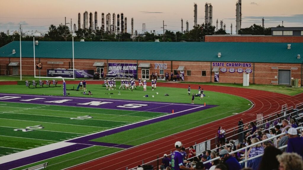 The chemical plant owned by Indorama Ventures, a major area employer, is visible from the high school football stadium in Port Neches, Texas, Sept. 29, 2026. President Donald Trump temporarily waived clean-air rules for industrial facilities that spew cancer-causing gases, and then his appointees worked to gut the regulations altogether. (Meridith Kohut/The New York Times)