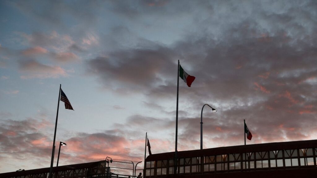 The flags of the U.S. and Mexico fly at dawn over the Lerdo-Stanton International Bridge as seen from Ciudad Juarez, Mexico, July 21, 2026. (Reuters File)