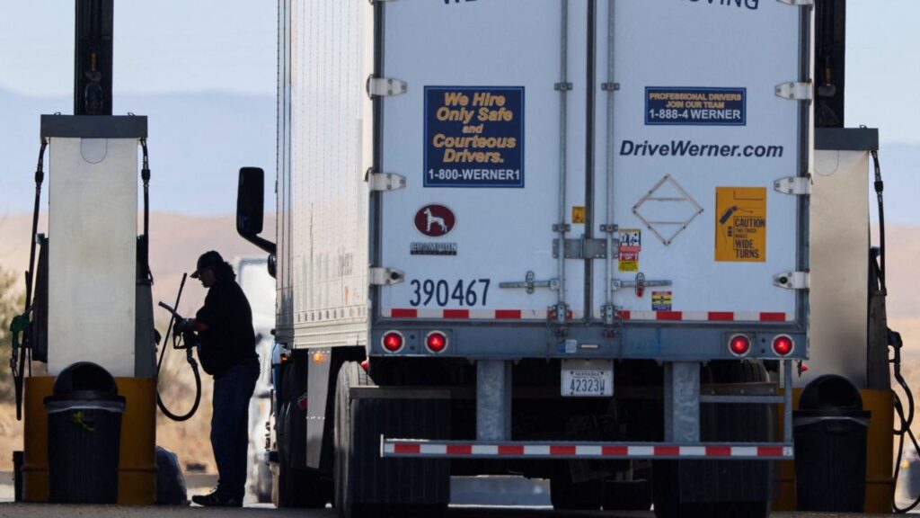 A driver operates the diesel pump at a truck stop in Dunnigan, California, U.S., September 28, 2026. Reuters/Fred Greaves/File Photo