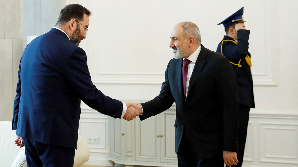 Armenia's Prime Minister Nikol Pashinyan greets MTS-Armenia shareholder Konstantin Sokolov during a meeting in Yerevan, Armenia in this picture released on March 15, 2024. (Armenian Prime Minister's Office/Handout via Reuters/File Photo)