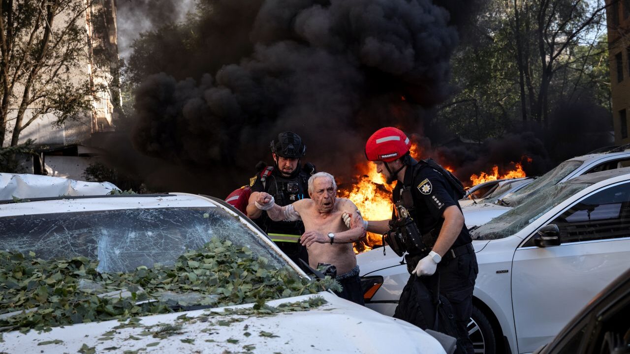 Image of rescue workers assisting an injured man after a Russian aerial strike in Ukraine