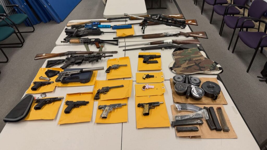 Visalia police arrested two people Wednesday after an investigation into illegal gun sales uncovered automatic firearms, stolen weapons, and equipment used to manufacture guns at a Tulare home. (Visalia PD)